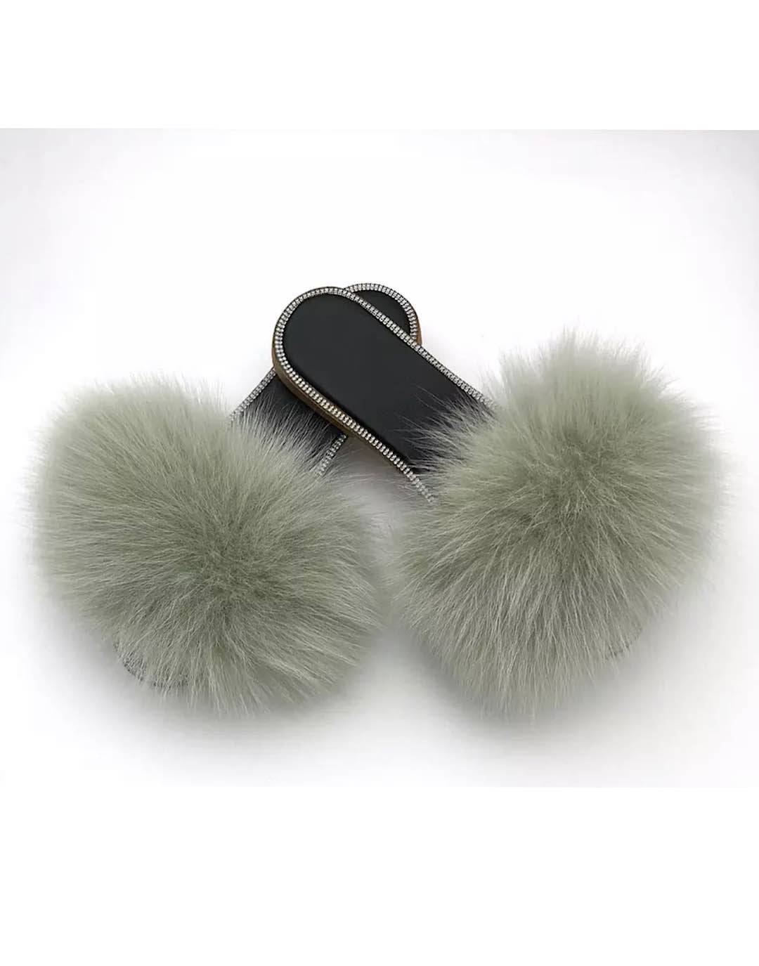 Natural fur slide sandals adorned with rhinestones