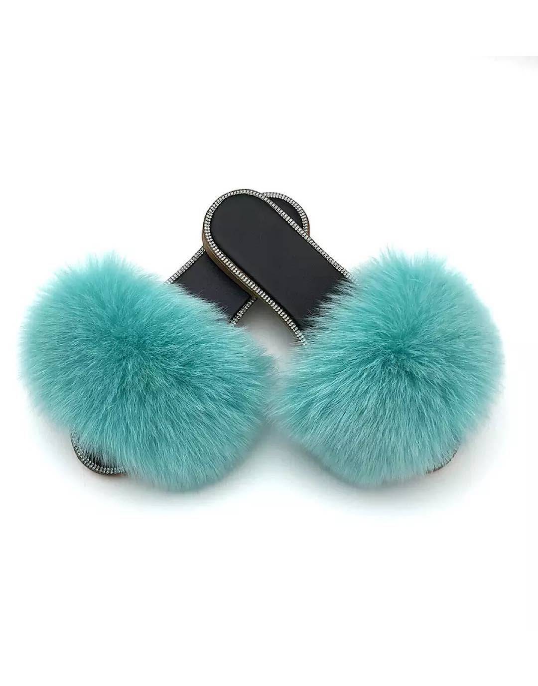 Natural fur slide sandals adorned with rhinestones