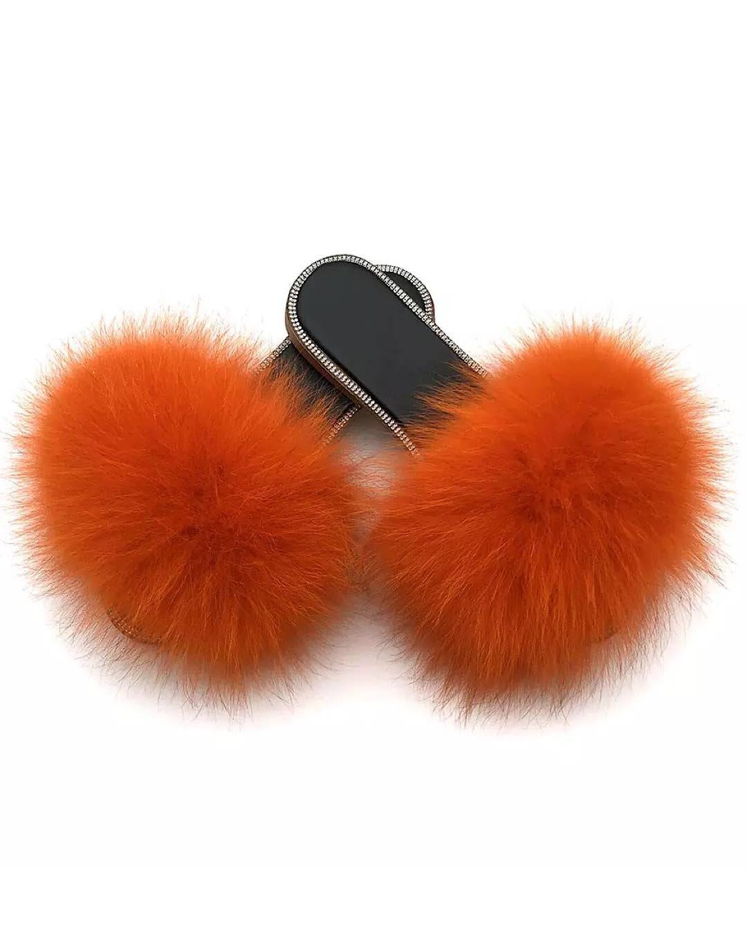 Natural fur slide sandals adorned with rhinestones