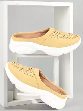 Yellow laser-cut slip-on mules for women with stitched back design.